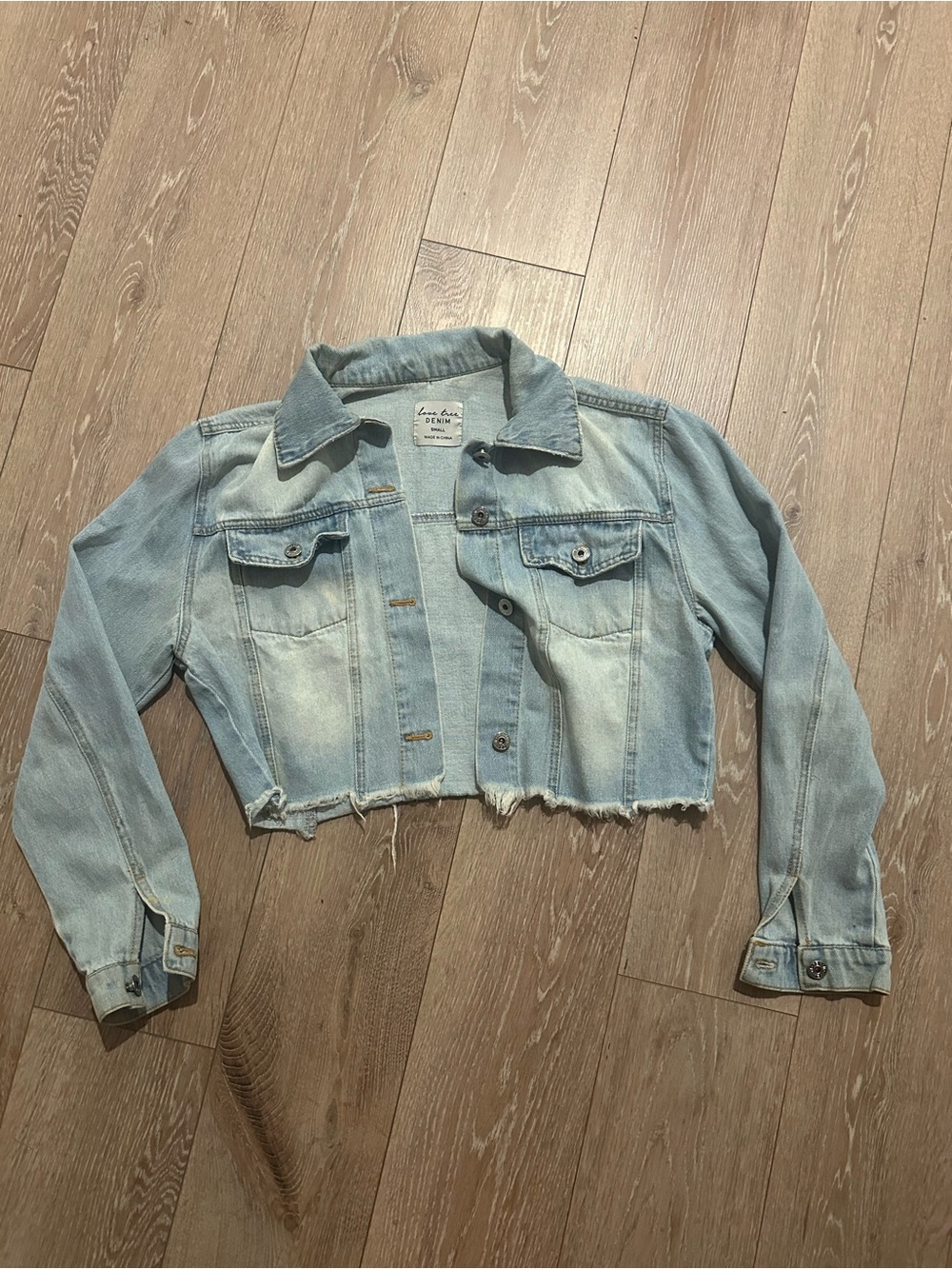 100% cotton Light Blue Cropped Denim Jacket with Raw Hem